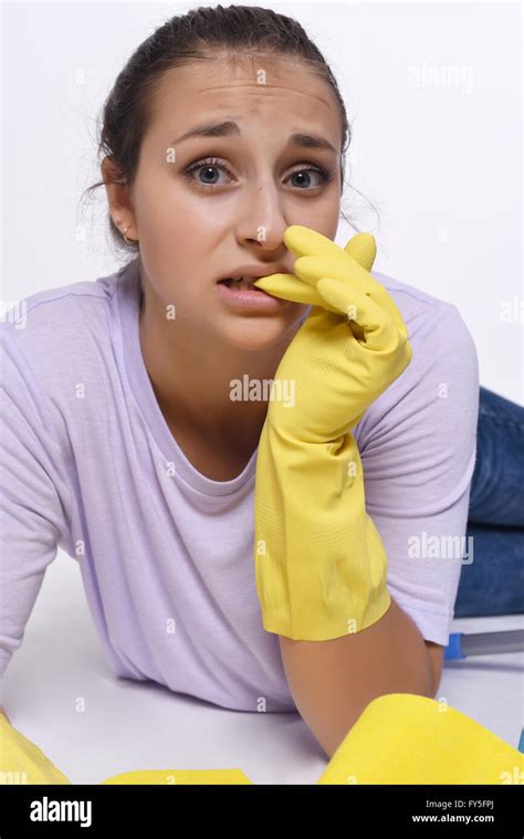 Portrait Of Young Beautiful Woman Tired Of Cleaning Up Isolated White