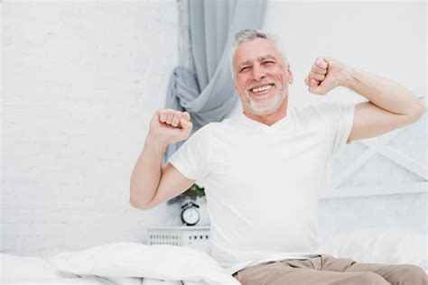 Elder Man Waking Up In The Bed Photo Free Download