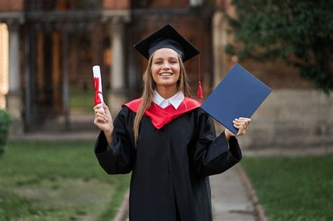 Free Photo Female Graduate In Graduation Robe With Diploma In Her