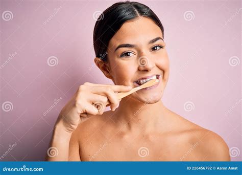 Young Beautiful Brunette Woman Brushing Her Teeth Using Tooth Brush And