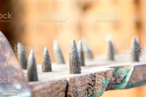 Old Wooden Chair With Spikes For Torture Stock Photo Download Image