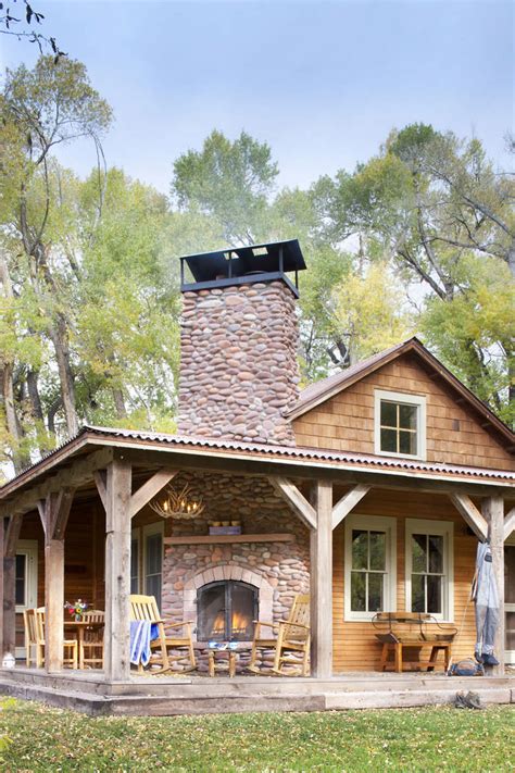 A Cozy Cabin With A Large Outdoor Fireplace Rcozyplaces