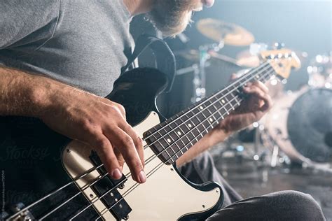 Closeup Of Hands Playing Electric Bass Guitar By Stocksy Contributor Ibexmedia Stocksy