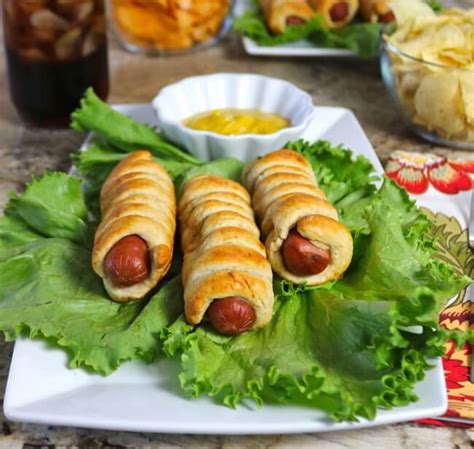 Line large cookie sheet with cooking parchment paper. Easy Recipe: Spiral Pretzel Hot Dogs Recipe - Happy and Blessed Home