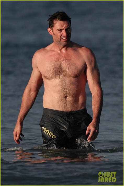 Hugh Jackman Runs Shirtless On The Beach With His Ripped Muscles On