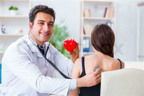 Doctor Checking Patient With Stethoscope Stock Image Colourbox