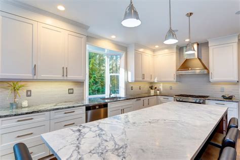 The specialty wall cabinets that fit above a refrigerator or range will be installed higher than other upper cabinets, and may also be deeper than the standard 12 inches. Granite or Quartz Countertops: Which Is The Best Option ...