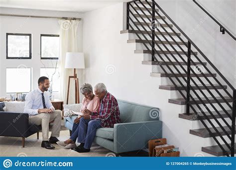 senior couple meeting with male financial advisor at home stock image image of investment