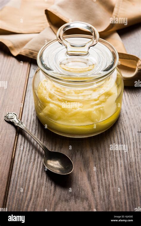 Desi Ghee Or Clarified Butter In Glass Or Copper Container Or Ceramic
