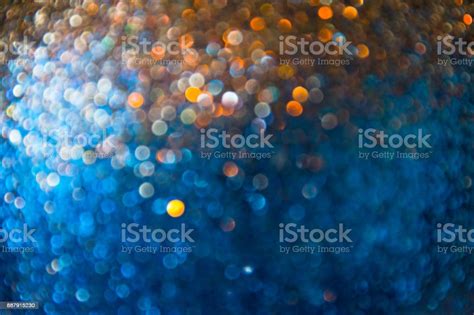 Abstract Blurred Bokeh Of Gold And Blue Twinkled Glitter Use For