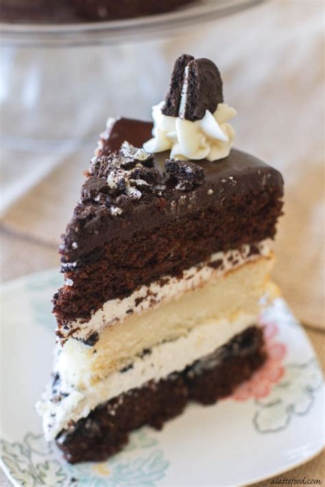 Layers Of Chocolate And Vanilla Cake Are Filled With Vanilla Frosting