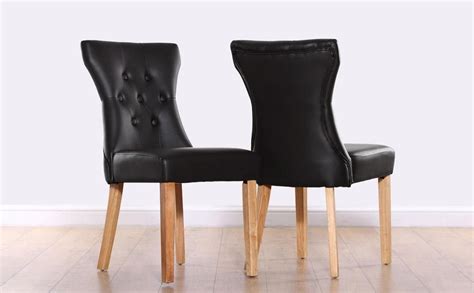 Well you're in luck, because here they come. Bewley Black Leather Button Back Dining Chair (Oak Leg ...
