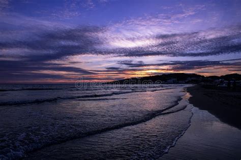 Beautiful Shot Of A Bright Purple Sunset Sky Over The Sea Stock Photo