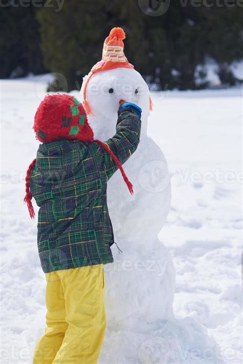 Boy Making Snowman 10707297 Stock Photo At Vecteezy