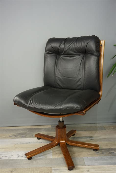 Our collection of vintage style leather chairs are so comfortable, you won't want to get. Vintage swivel office chair in wood and leather - 1970s ...