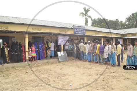 Image Of Indian Voters Standing In Queue Lines For Casting Their Votes