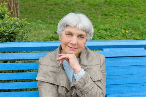 Beautiful Cute Elderly Woman Sitting Park Bench Blue Stock Photos