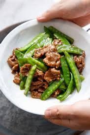 In a bowl whisk together the chicken broth, honey and soy sauce. pioneer woman beef and snow pea stir fry recipe - Google ...