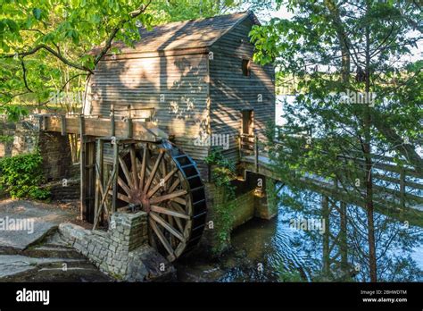 Scenic Old Grist Mill With Active Overshot Waterwheel At Stone Mountain