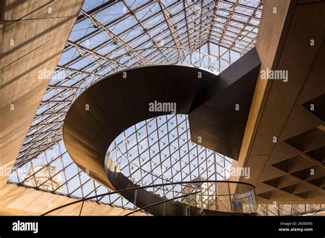 Curved Staircase In The Underground Lobby Of The Louvre Pyramid Of The