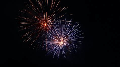 Download Wallpaper 1366x768 Fireworks Sparks Night Holiday Dark