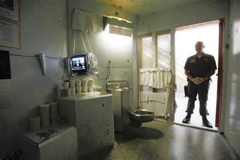 A Guard Stands In The Doorway Of A Cell At Pelican Bays Shu Pelican