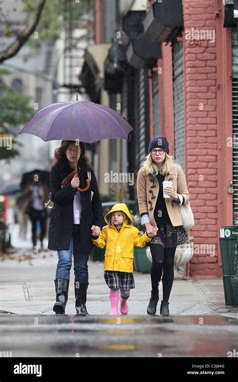 michelle williams and daughter matilda ledger brave the morning rain to pickup coffee new york