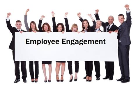 Happy Workers Holding Signemployee Engagement — The People Equation