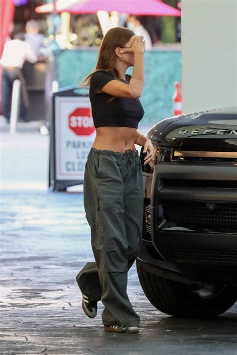 Hailey Bieber Shows Off Her Toned Midriff In A Black Crop Top While Visiting An Office Building