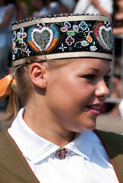Latvians share a common latvian language, culture and history. Girl from the parade of the Song and Dance Festival ...