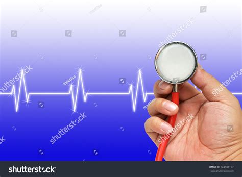 Stethoscope In Hand With Heart Beats Cardiogram Stock Photo 124181197