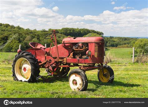 Vintage Red Tractor In Landscape Stock Photo By ©ivonnewierink 250777776