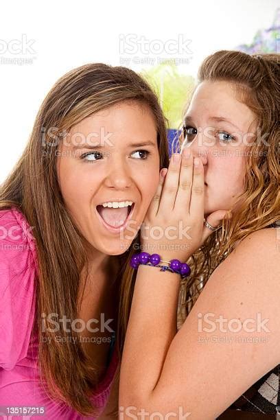 Two Teenagers Sharing Secrets Stock Photo Download Image Now 16 17