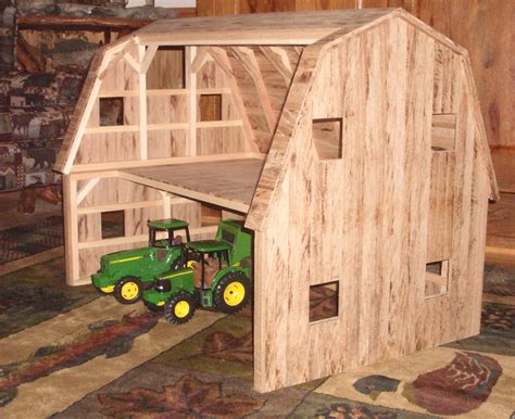 Someone sets a glass on a wooden tabletop. These unique toy barns are built from reclaimed pine and ...