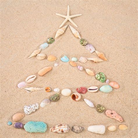 Beach Xmas Concept Christmas Tree On Sand Made Out Of Sea Shells Stock