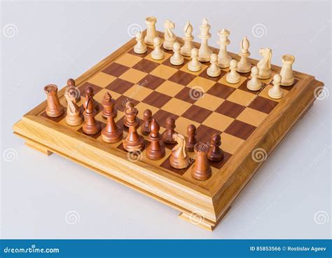 Chess Pieces In Starting Position On A Wooden Board Stock Photo Image