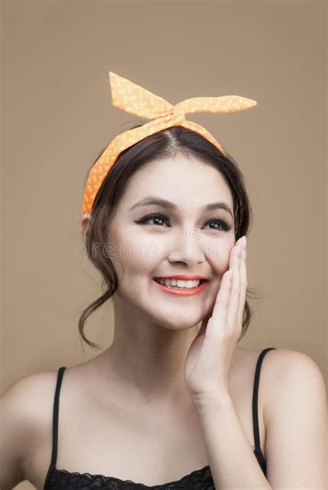 Portrait Of Asian Girl With Pretty Smile In Pinup Style Touching Stock