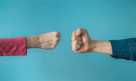 Two Fists Punching Stock Photos Pictures And Royalty Free Images Istock
