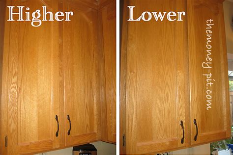 For upper cabinets, be sure to attach the handle near the bottom of the door. I had to decide between hanging them higher on the ...
