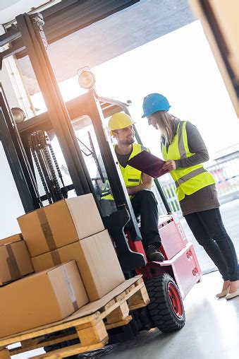 Maybe you would like to learn more about one of these? Forklift Driver Talking To A Manager In The Warehouse Stock Photo & More Pictures of 30-39 Years ...