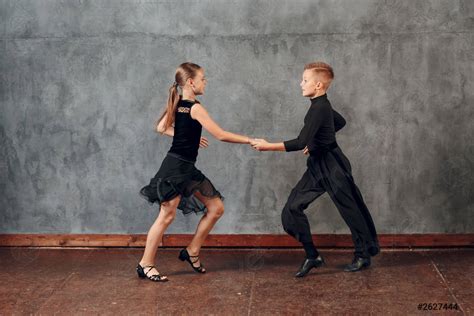 Young Couple Boy And Girl Dancing In Ballroom Dance Jive Stock Photo