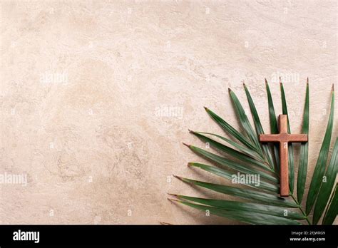 Palm Sunday Concept Wooden Cross Over Palm Leaves Reminder Of Jesus