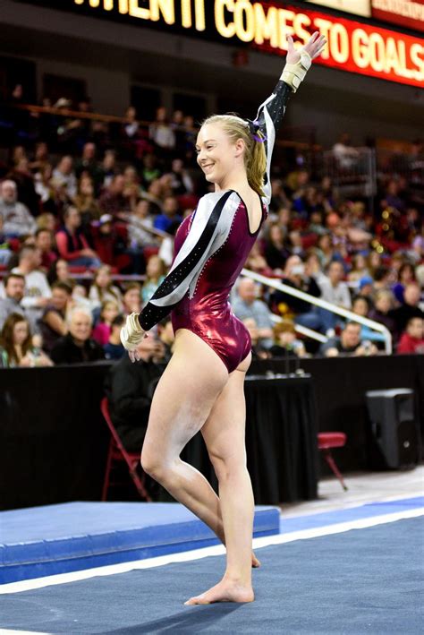 University Of Denver Gymnast Rachel Fielitz Smiles While Holding A Pose During Her Floor Routine