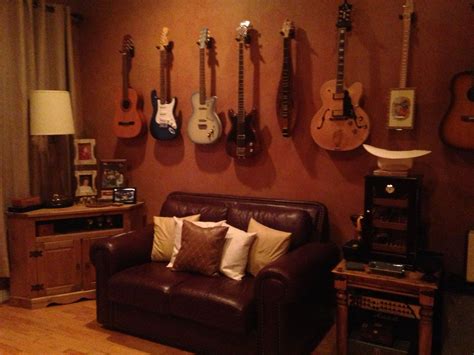 Heres A Perty Looking Mancave With Some Cool Guitars Adorning The Wall