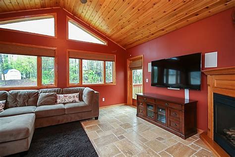 Log home & cabin pictures | rustic renovation photos. Sun Room, in-floor heat, knotty pine vaulted ceiling and ...