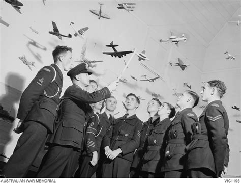A Group Of Air Training Corps Members Being Given Instruction In