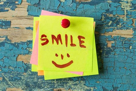 Smile Text Written On Sticky Note On Wooden Background Stock Image