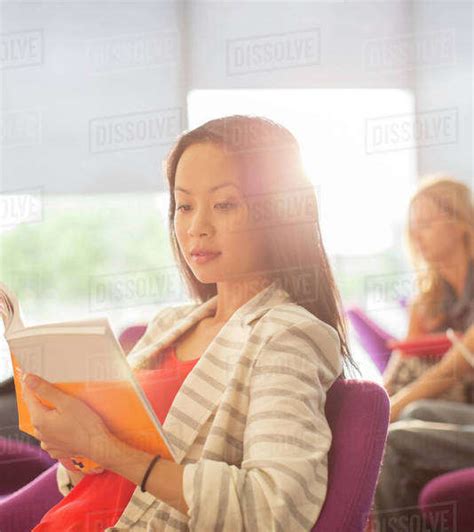 University Student Reading In Lounge Stock Photo Dissolve
