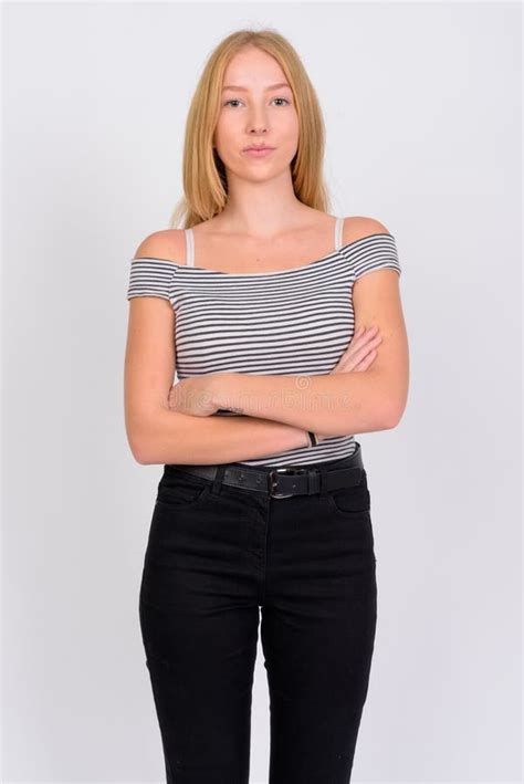 Portrait Of Young Beautiful Blonde Teenage Girl With Arms Crossed Stock