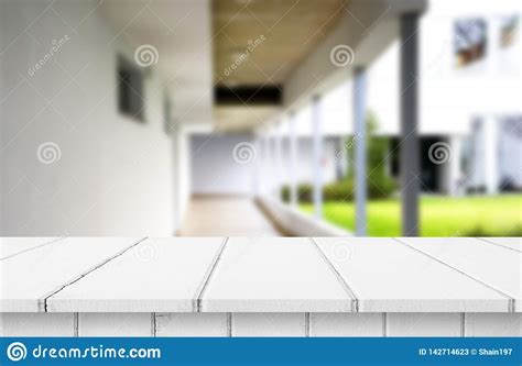 Wood White Table Top On Blur Building Hall Background Form